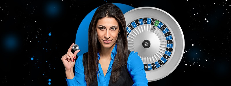 roulette live dealer holding a ball