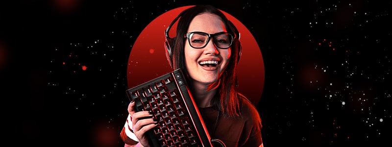 an esports player with a keyboard in her hands