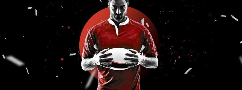 a rugby player holding the ball confidently that his team is able to win