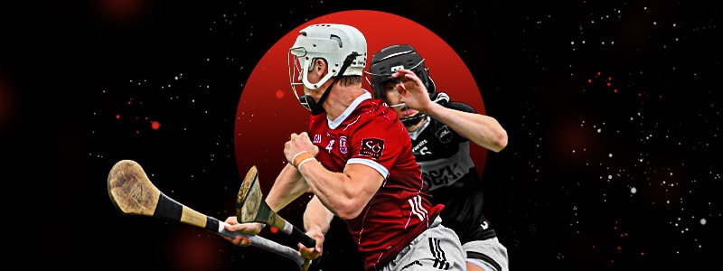 two hurling players from the opposite teams during a competition