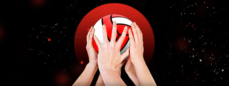 water polo players' hands holding the ball