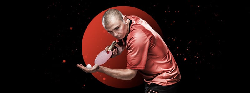 table tennis player preparing to strike